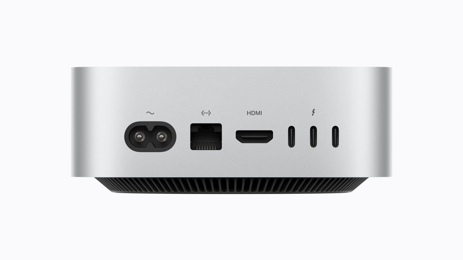 Rear of the silver M6 Mac mini showing the power inlet, Ethernet port, HDMI port and three Thunderbolt 4 ports above a dark ventilated base